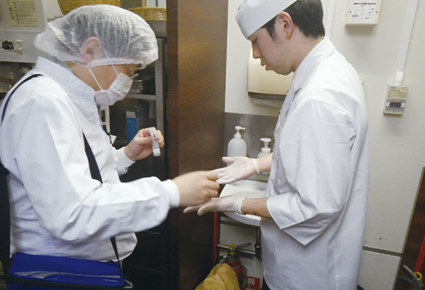 Staff undergo kitchen hygiene inspection by a third-party organization.
